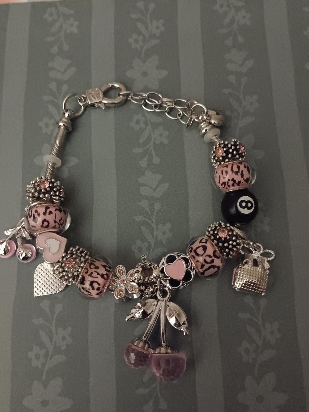 Silver Charm Bracelet with Pink Leopard Beads and Black Accent
